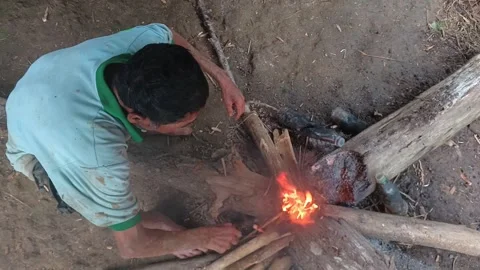 An Indonesian farmer taking a break. Stock Footage 321933341