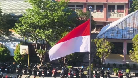 Indonesian flag fluttering at the school Stock Footage 337527002