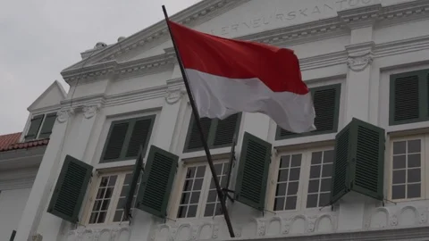 Indonesian flag in front of Fatahillah museum Jakarta (Slowmotion) Stock Footage