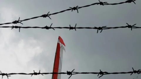 Indonesian flag, red and white with sky background Stock Footage 308931902