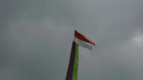 Indonesian flag, red and white with sky background Stock Footage 308931957