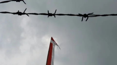 Indonesian flag, red and white with sky background Stock Footage 308932032