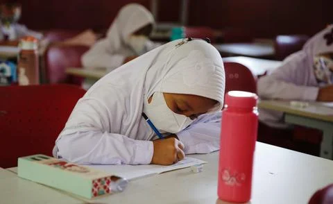 Indonesian Government issues guidelines to implementation of limited face-to-fac Stock Photos