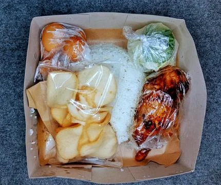 In Indonesian it is called Rice Box or Nasi kotak Stock Photos
