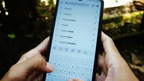 Indonesian man is looking for articles about Brigadier Joshua on google Stock Footage 204852275