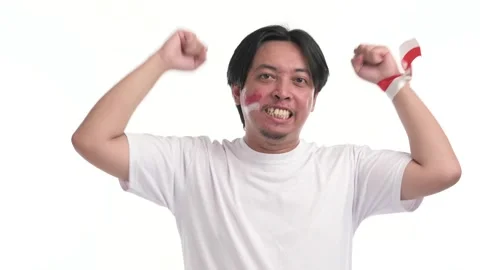 Indonesian man supporting with spirited expression Stock Footage 246835706