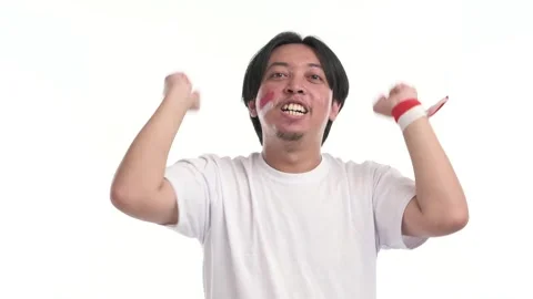 Indonesian man supporting with spirited expression Stock Footage 246835712