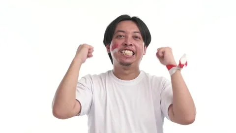 Indonesian man supporting with spirited expression Stock Footage 246835713
