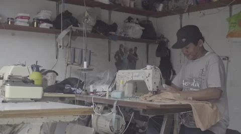 Indonesian man using sewing machine in a workshop, editorial, ungraded, slog2 動画素材 61022783