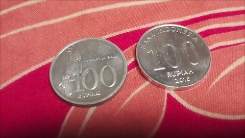 Indonesian one hundred rupiah note in its time Stock Footage 296303543