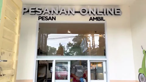 Indonesian restaurant concept ordering online food delivery services Stock Footage 237478923