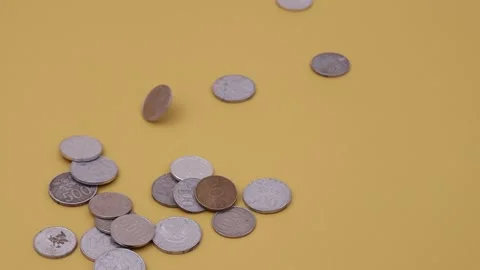 Indonesian Rupiah coins falling Stock Footage 250281526