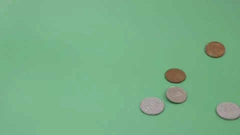 Indonesian Rupiah coins falling Stock Footage 250281533