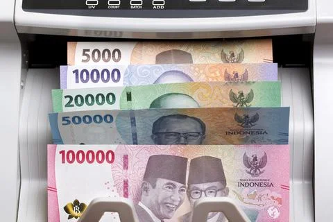 Indonesian rupiah in the counting machine Stock Photos