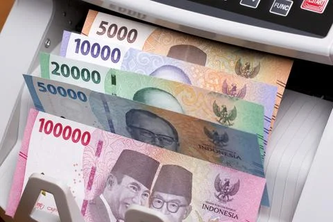 Indonesian rupiah in the counting machine Stock Photos