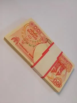 Indonesian Rupiah: A Stack of 100 Rupiah Notes Stock Photos