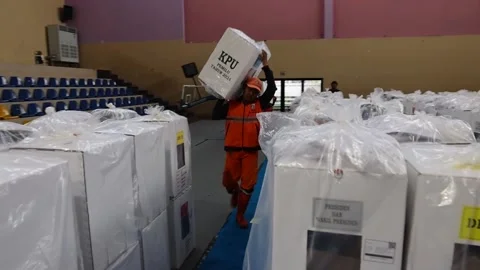 Indonesian workers distribute ballot boxes ahead of general elections, INDONESIA Vídeo Stock 264587041