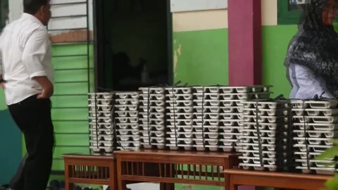 Indonesia's free meal programme under fire after child poisonings, INDONESIA, ID Stock Footage 318866798