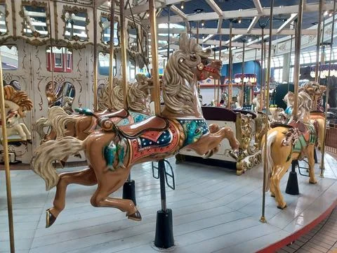 Indoor Amusement Park Features a Carousel with Horses Stock Photos