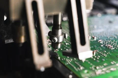 Indoor closeup shot showing the process of creating modern PCB that is wiring Stock Photos