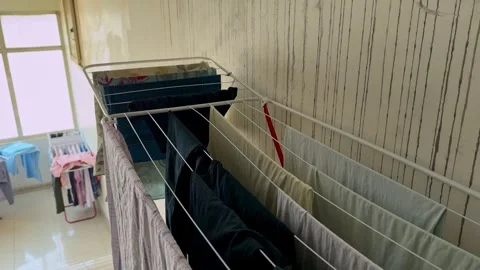 Indoor Clothes Drying Rack Near Sunny Window Stock Footage 340856435