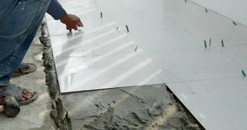 Indoor concrete tile installation process instructional visuals for home Stock Footage 331938858