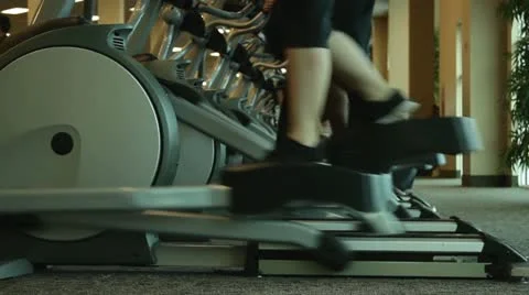 Indoor Elliptical Gym Workout Stock Footage 10858240