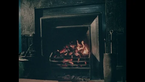 Indoor fireplace with burning coal, Blaenavon Colliery, UK 1978 Stock Footage