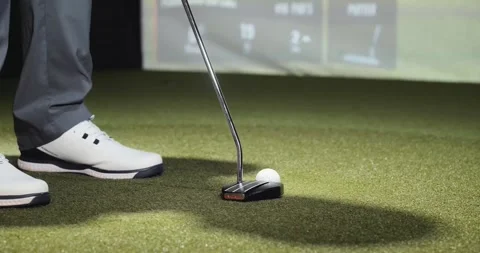 Indoor golf simulator, golfer putting ball into simulator screen close up 4k Stock Footage 163992528