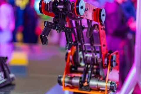 Indoor image of an active, red multi-axis robotic arm in a professional set.. Stock Photos