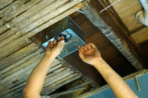 Indoor installing vents in the ceiling. Stock Photos
