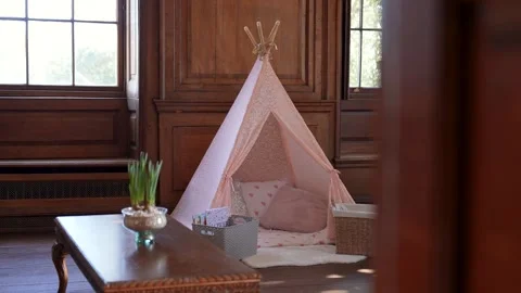 Indoor pink Tipi / Teepee set up inside a large room Stock Footage 304955802