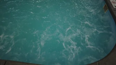 Indoor Pool Water With Brick Edge Reflects a Calming Ambiance Stock Footage 301714154