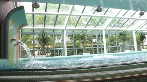Indoor pool with waterfall Stock Footage 62314549