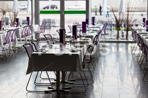Indoor restaurant tables ready for service Stock Photos