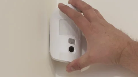 Indoor security system equipment, installation of smart motion sensor, wireless Stock Footage 163827131