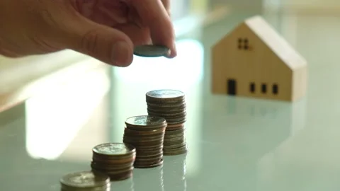 Indoor shot. Selective focus, close up at men hand put coins into increase st Video stock 146363861
