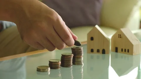 Indoor shot. Selective focus, close up at men hand put coins into increase st Video stock 146363866