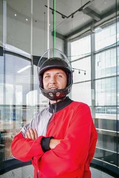 Indoor skydiving instructor prepares for a flight experience session Stock Photos