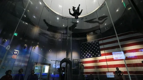 Indoor skydiving wind tunnel man acrobatic 4K 스톡 동영상 120377700