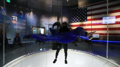 Indoor skydiving wind tunnel man first flight 4K 스톡 동영상 120378050