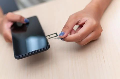 Indoor smartphone scene close-up sim card insertion and mobile connectivity 写真素材