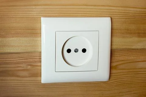 Indoor socket built into wall sheathed with wooden lath Stock Photos
