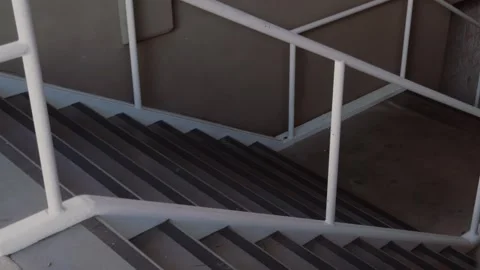 Indoor Staircase Glide Shot Ending Behind Structural Pillar Stock Footage 337658269