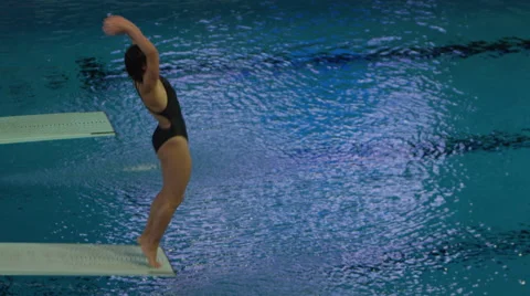Indoor Swimming Pool - Athletic Competitive Diving Stock Footage