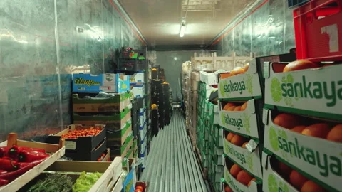 Indoor view of a transporting truck filled with various types of vegetables and Stock Footage 254827491