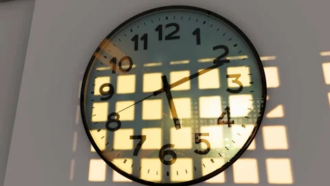 Indoor wall clock with sunlight and shadow delay Video stock 325760793