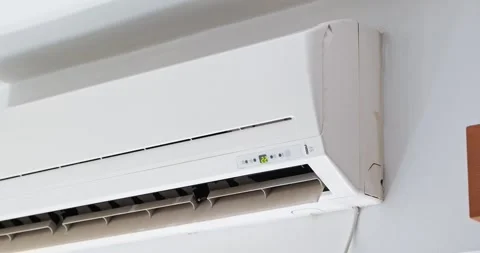 Indoor wall-mounted air conditioner with moving flap in use Stock Footage 339781479
