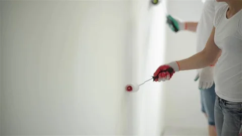 Indoors Portrait of Active Happy Couple Doing Apartment Repair Together. Young Stock Footage 80968331