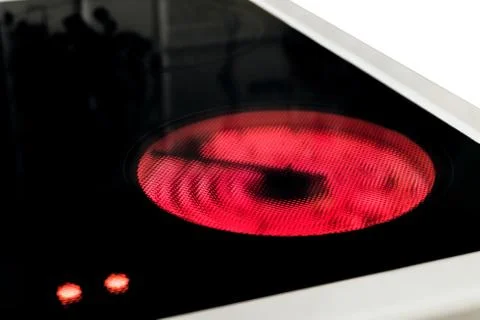 Induction cooker with control hot temperature indicators. Electric hob. Stock Photos
